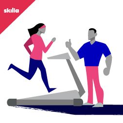 Donna su tapis roulant con istruttore